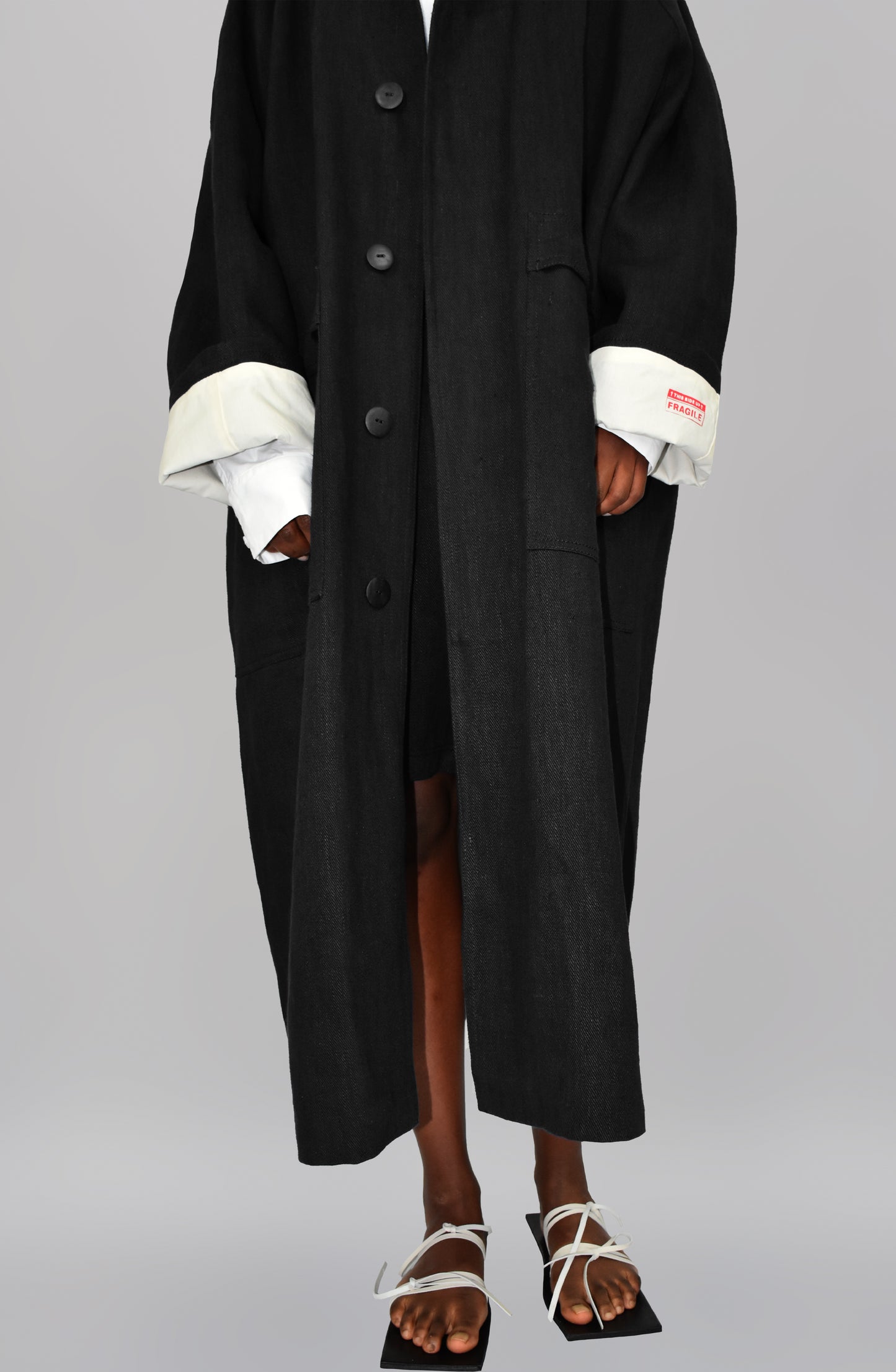 THE 'SIDE UP' COAT IN BLACK
